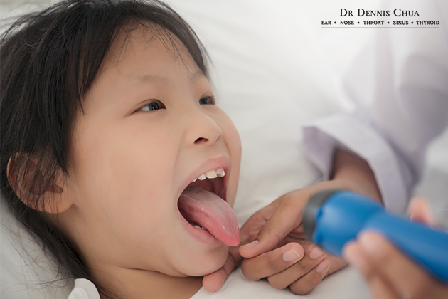 a child sticking her tongue out