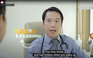 Dr. Chua speaks to a patient in a clinical setting