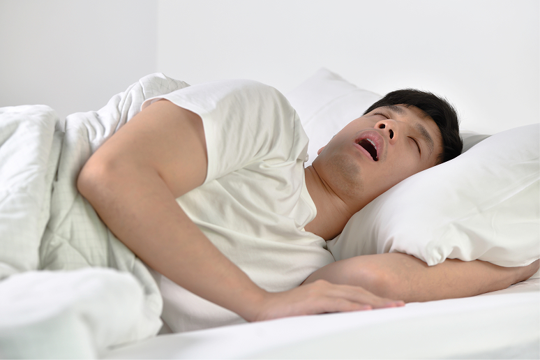 young-asian-man-sleeping-snoring-loudly-lying-bed