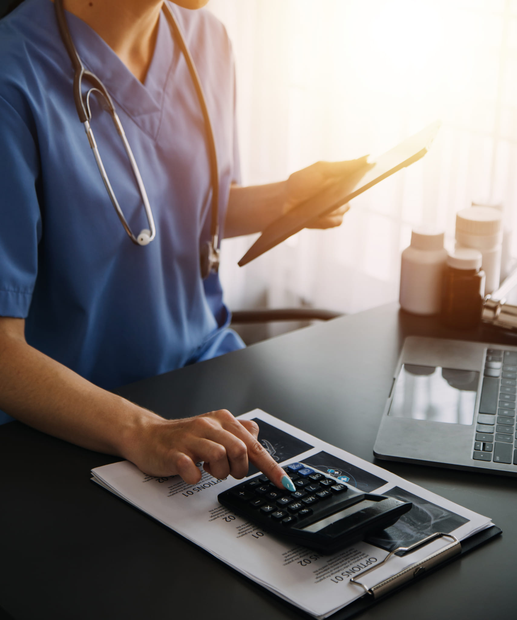 doctor hand holding pen writing patient history list clipboard about medication treatment